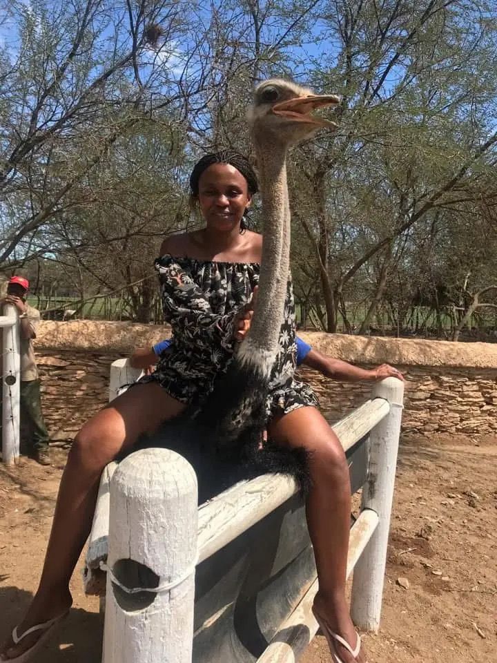 Riding an ostrich at Oudtshoorn