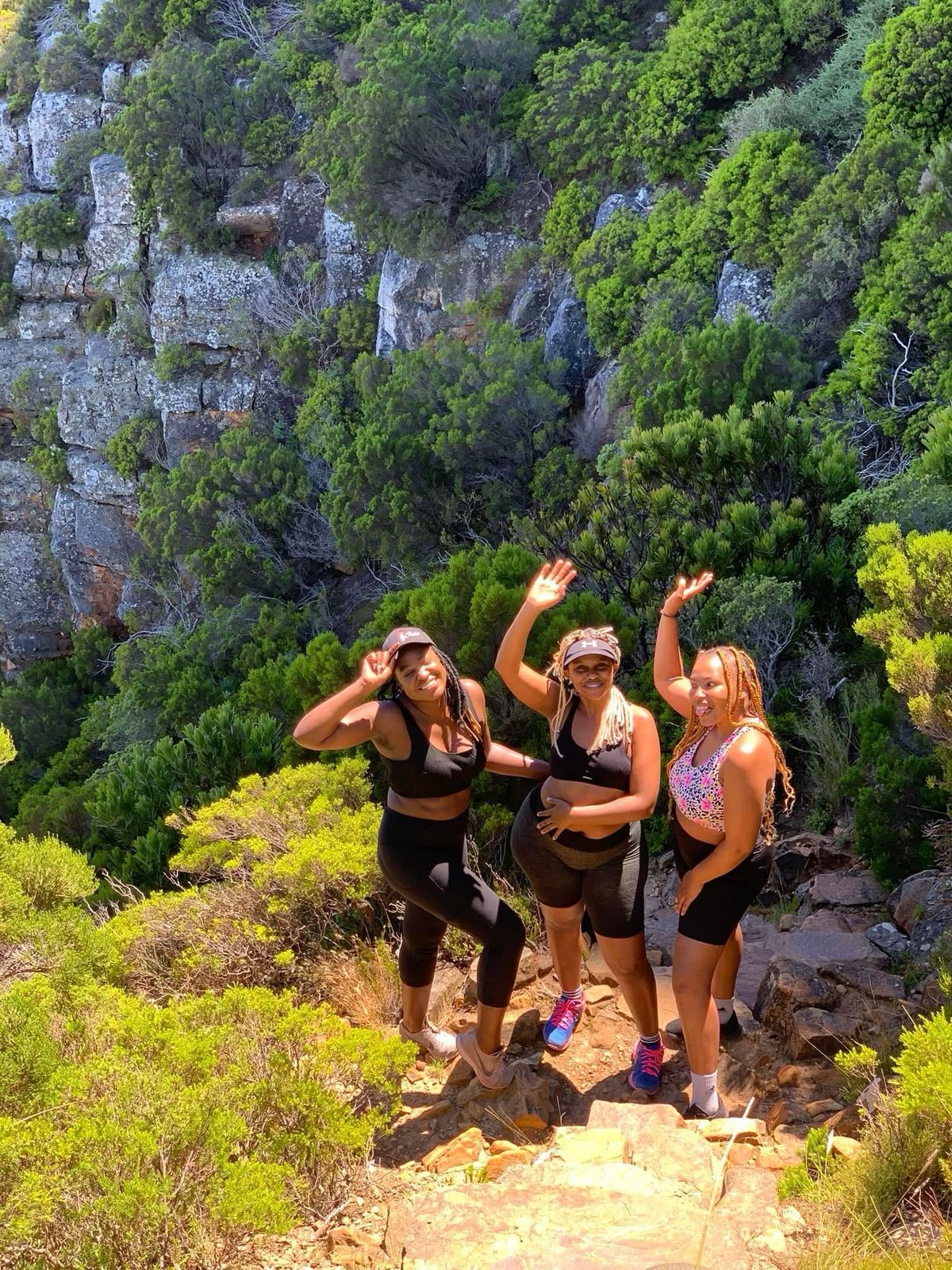 Three friends hiking in the mountains